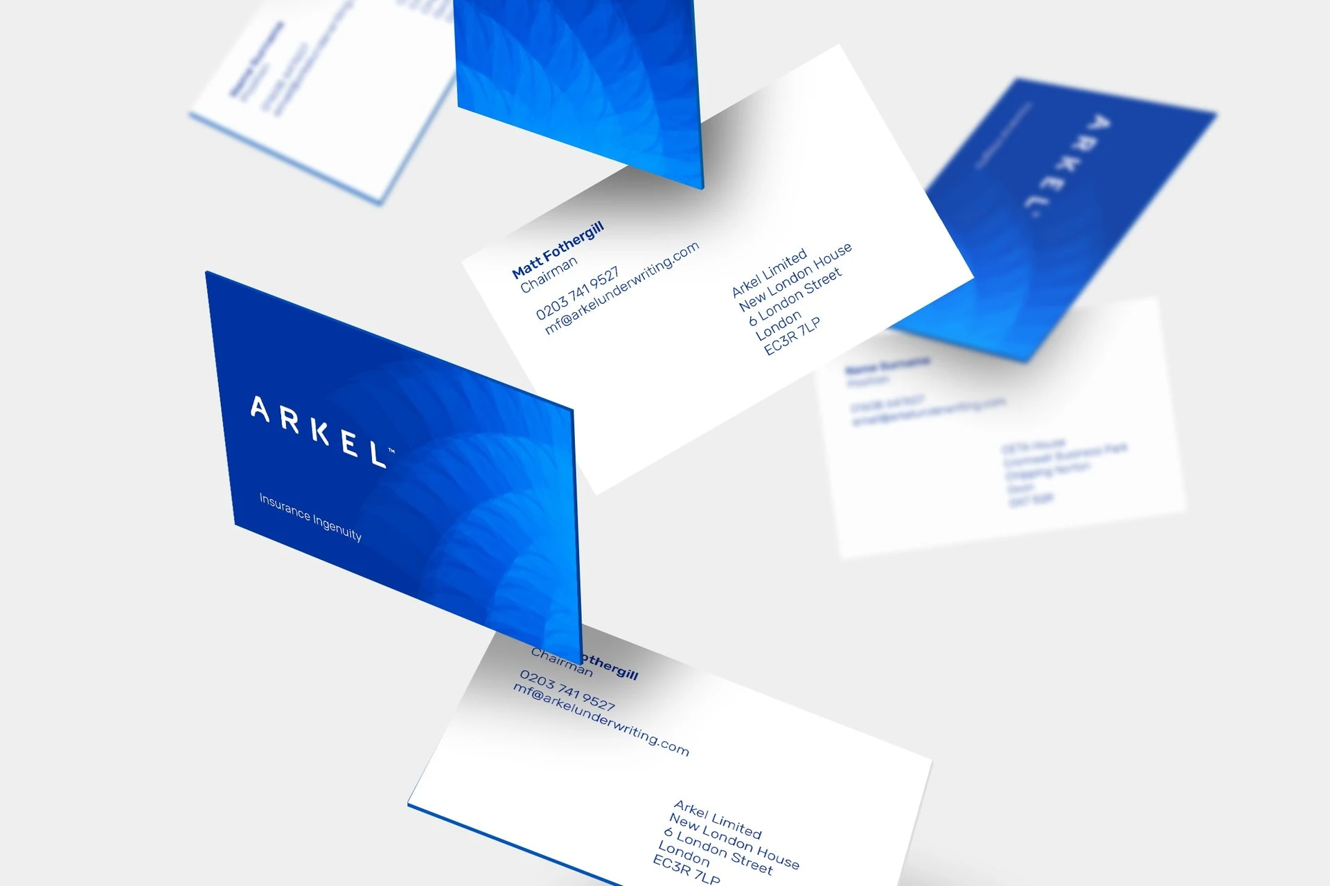 Arkel brand identity applied to blue and white stationery